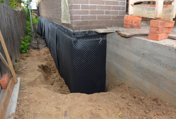 SJ Waterproofing Pros technician performing targeted Interior Drainage System assessment in West Islip, NY